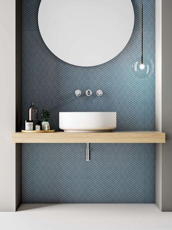 Tiny Blue Tiles Create a Textured Backdrop for the Vanity