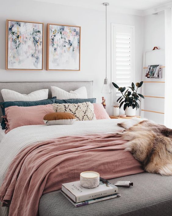 Pair of Abstract Art Pieces Adds Soft Color Above the Bed