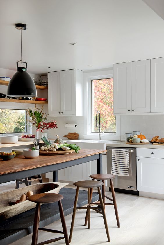 Ground Your Kitchen with a Dark Base and Warm Wood Top