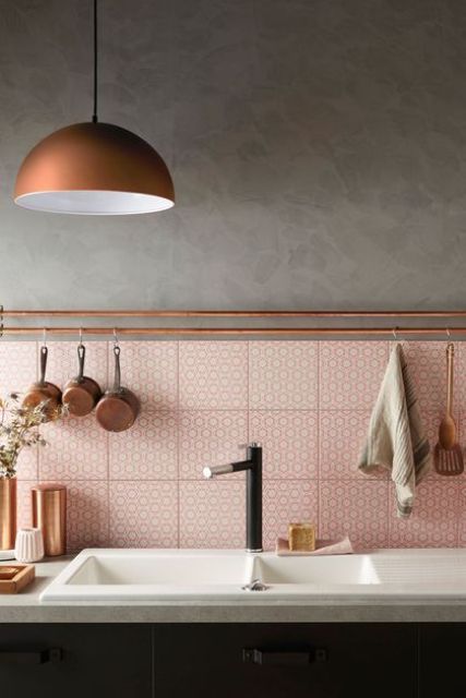 Copper Rail With Hanging Pots Adds Warmth Above Pink Tiles