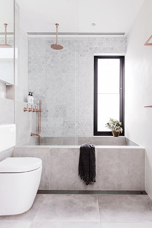 Concrete Bathtub With A Small Plant On The Ledge