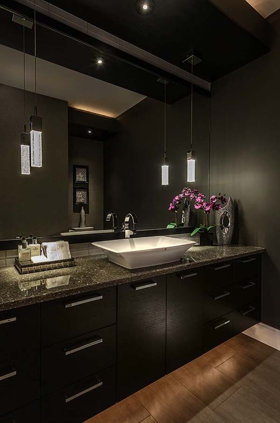 Anchor Your Space with a Dark Vanity and Vessel Sink
