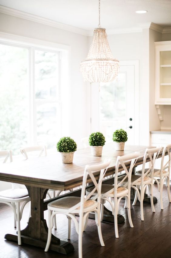 Symmetrical Topiaries Frame a Trestle Table
