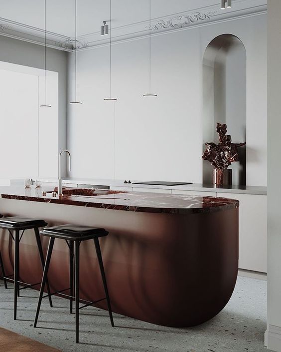 Curved Island Base With Marble Top Creates a Dramatic Focal Point