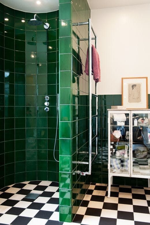 Glossy Emerald Tiles Create a Dramatic Shower Enclosure