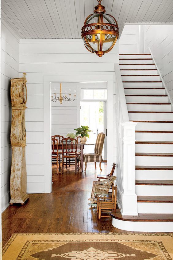 Distressed Grandfather Clock Anchors Entryway
