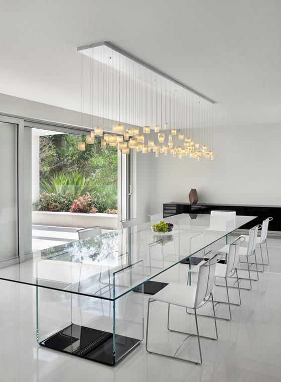 Contemporary Chandelier With Floating Cubes Over Glass Table