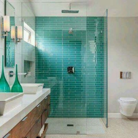 Glass Shower Enclosure Highlights Teal Subway Tile Walls