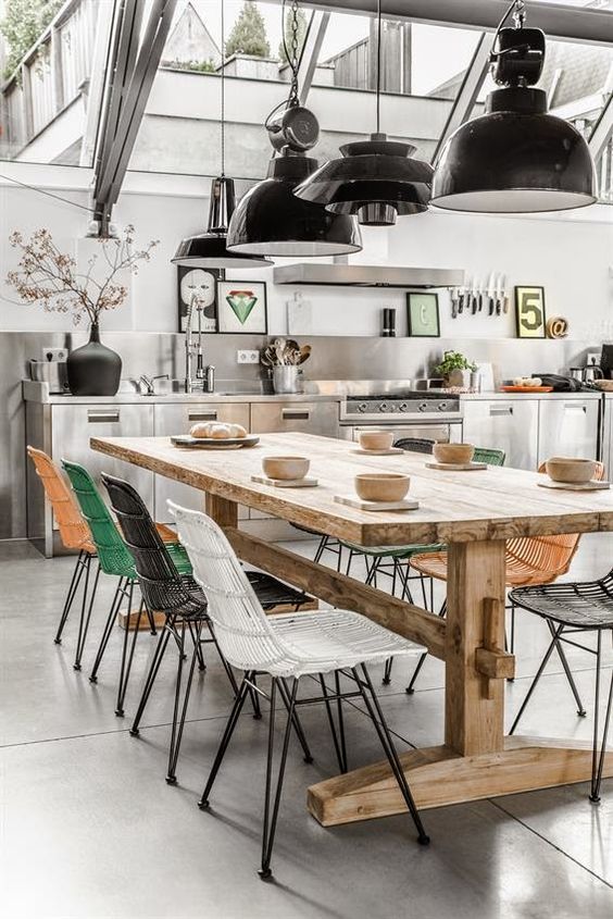 Playful Chairs Contrast with a Rustic Table