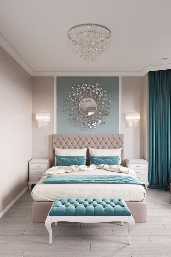 Sunburst Mirror Adds Glamour Above Tufted Headboard