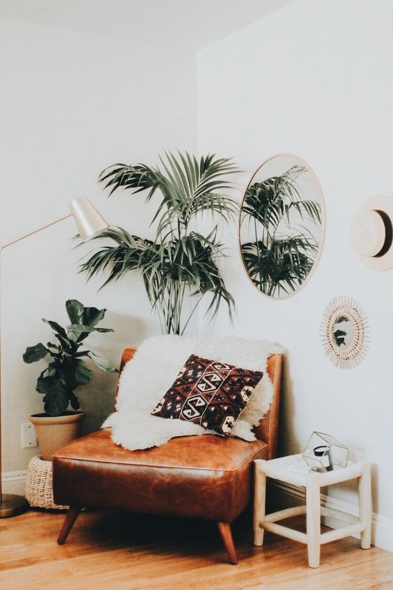 Round Mirror Reflects Greenery and Adds Depth