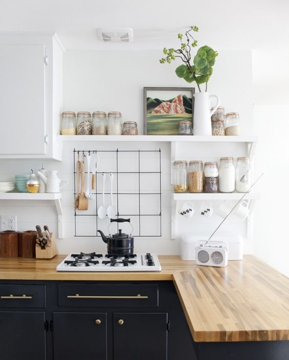 Wire Grid With Hooks Holds Utensils and Mugs