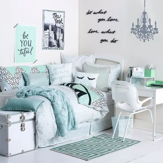 Mint Green Geometric Rug Grounds the Bed Area