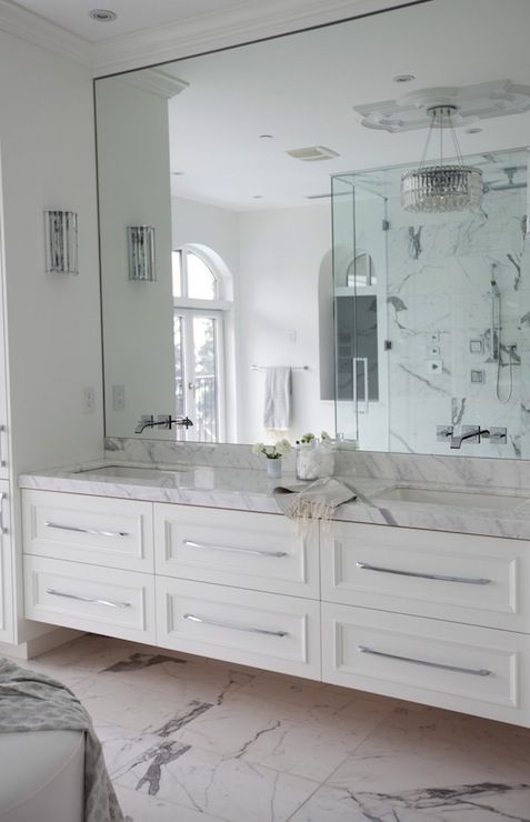 Sleek Chrome Hardware on White Vanity Drawers