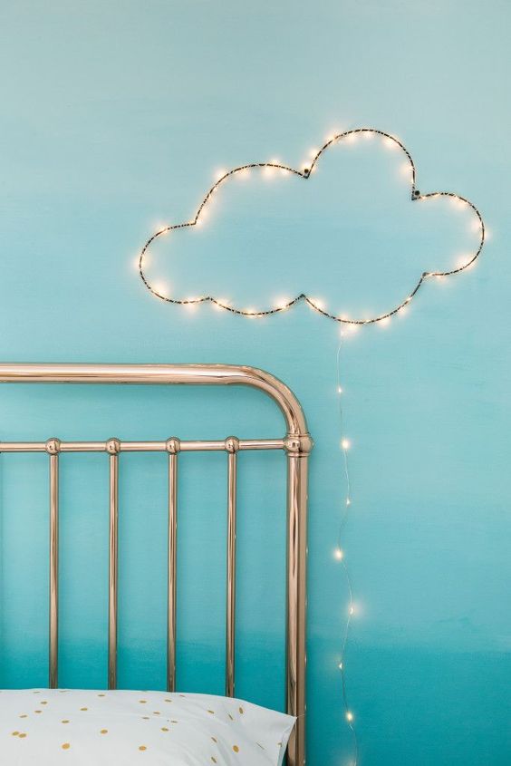 Cloud-Shaped String Lights Add Whimsy Above a Bed