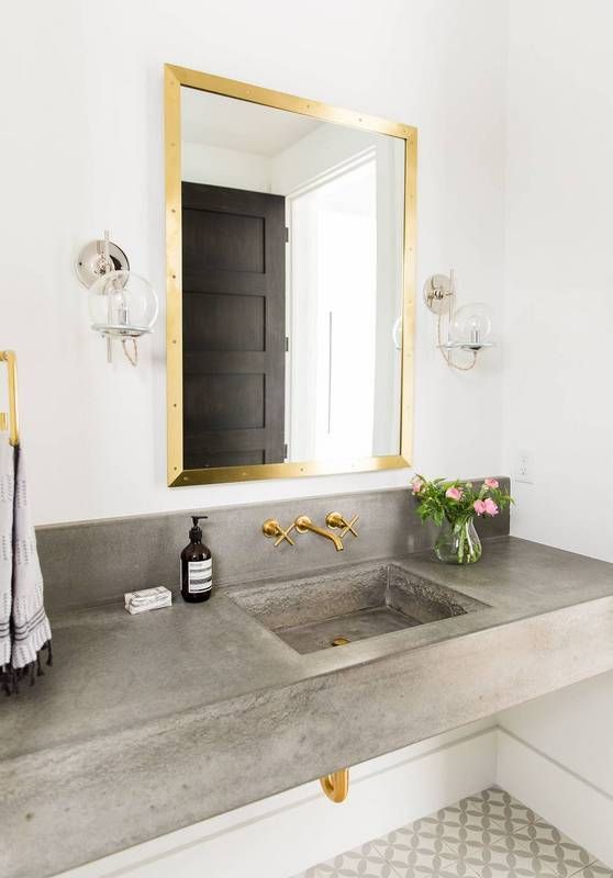 Concrete Countertop With A Small Vase Of Flowers