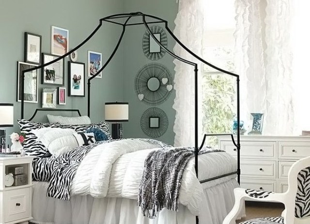 Gallery Wall Creates a Personal Statement Above the Bed