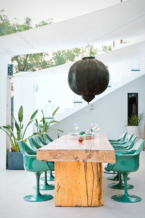 Ornate Lantern Adds Dramatic Ambiance Above Dining