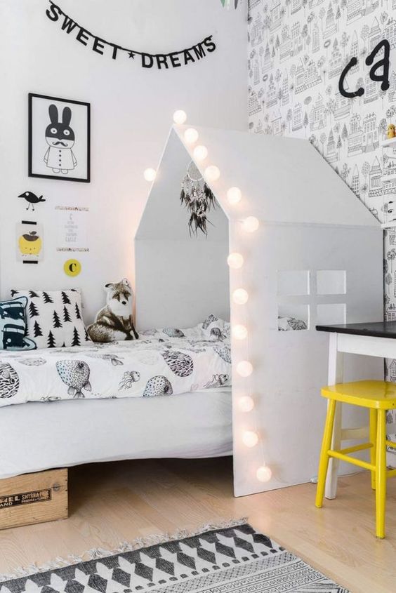 String Lights Outline a Playful House Bed