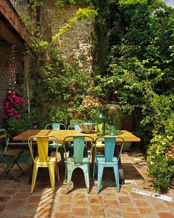 Incorporate Distressed Metal Chairs for Color Pops