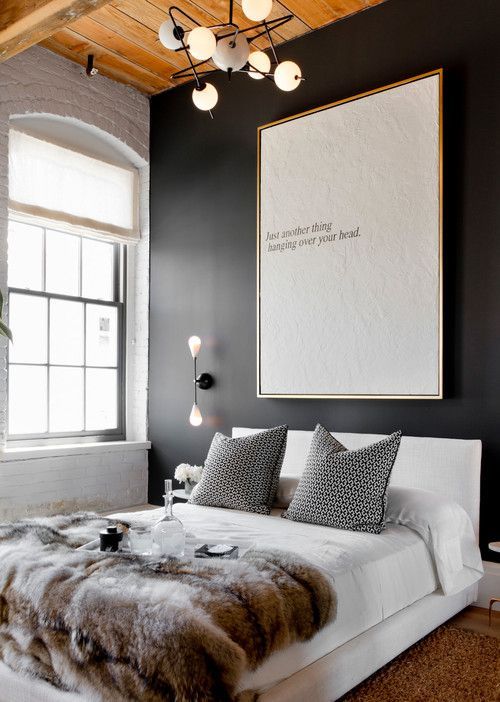 Large Textured Art Anchors a Dark Wall