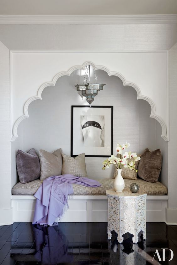 Ornate White Archway Frames a Built-In Nook