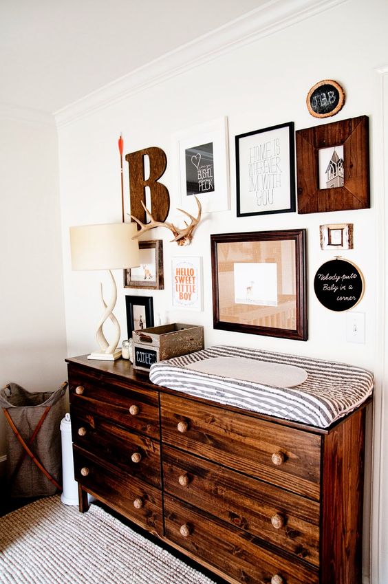 Gallery Wall Above Dark Wood Dresser Adds Personality