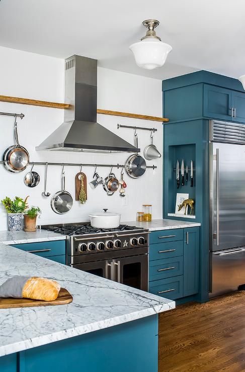 Wall-Mounted Rails Keep Pots and Utensils Within Easy Reach