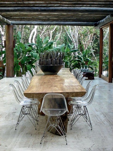 Clear Ghost Chairs Make a Live-Edge Table Feel Light