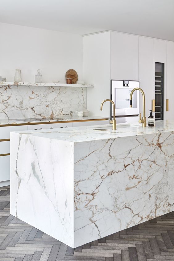 Two Gold Faucets Add Warmth to Marble Island