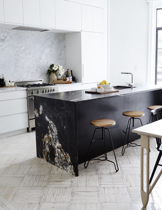 Anchor Your White Kitchen with a Dramatic Dark Stone Island