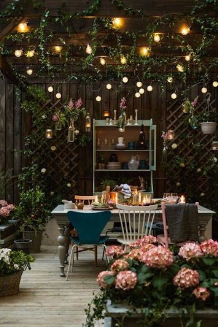 Hanging Glass Bottles Add Whimsical Charm to Trellises