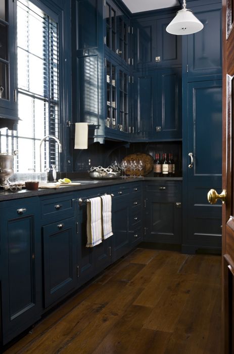 Dark Blue Cabinetry with Built-In Wine Storage