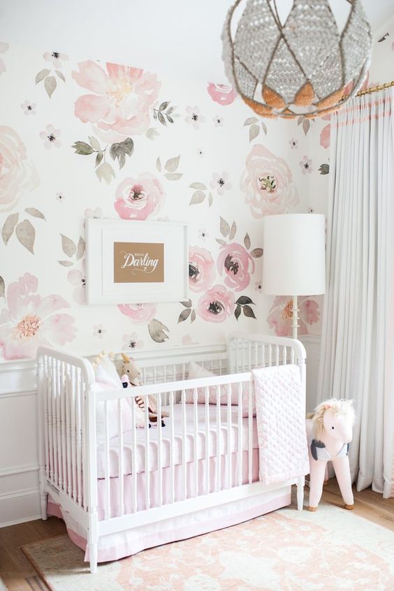 Soft Pink Floral Wallpaper Creates a Gentle Nursery Backdrop