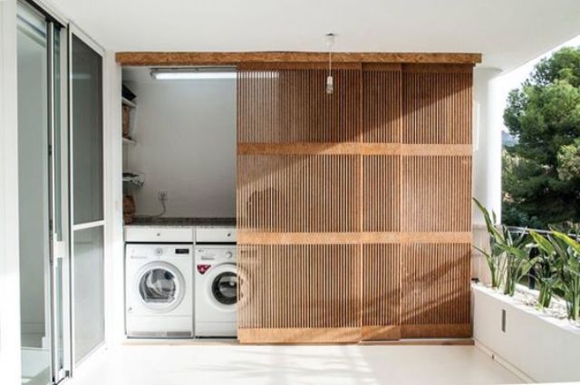 Hide Your Laundry Area with a Sliding Wood Slat Screen