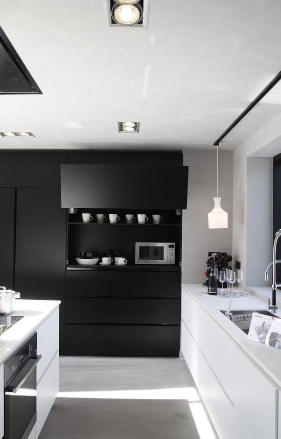 Cabinet with Drop-Down Door Hides the Microwave