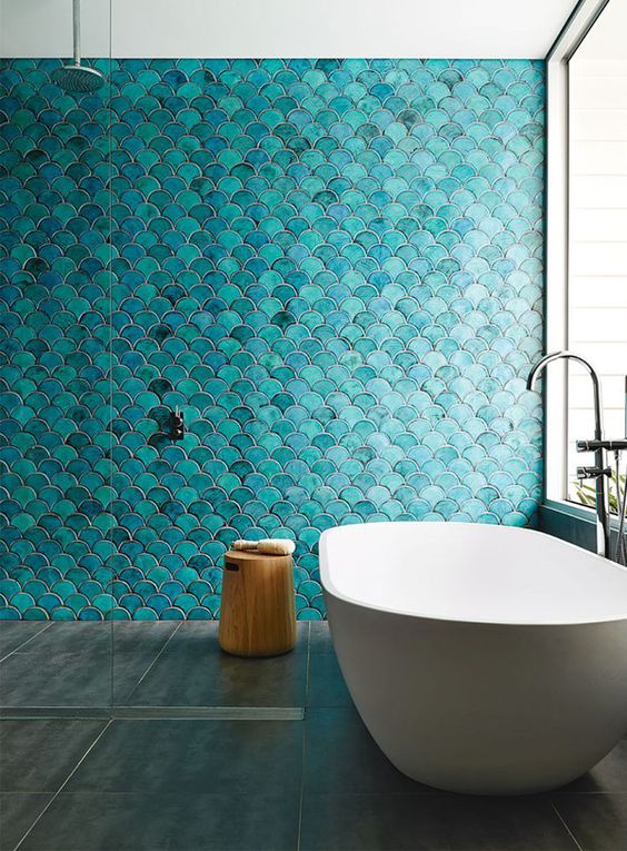 Scalloped Turquoise Tiles Create a Mermaid-Like Wall Feature