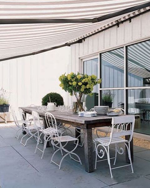 Striped Awning Offers Cool Shade Over Your Patio Table