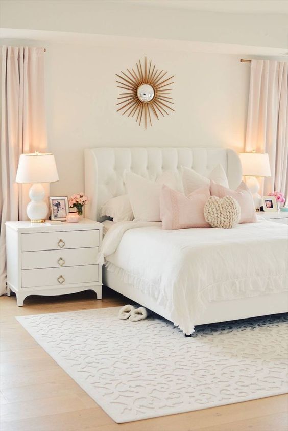 Starburst Mirror Adds a Glamorous Focal Point Above the Bed