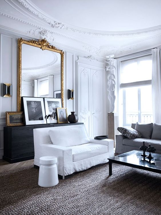 Expand Room Light With a Tall Gold Mirror