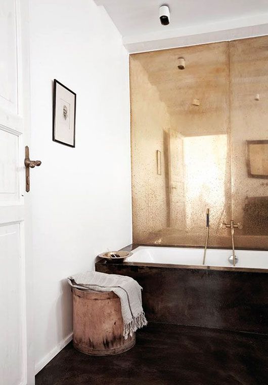 Distressed Mirror Wall Adds Antique Glamour Behind the Tub