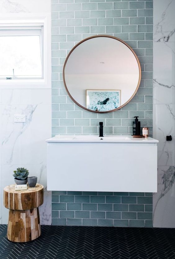 Wooden Stool Adds Natural Texture Next to Floating Vanity