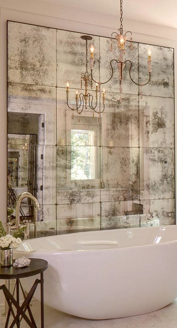 Distressed Mirror Panels Create a Textured Focal Wall