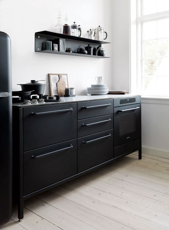 All-Black Cabinetry with Integrated Oven and Minimalist Handles