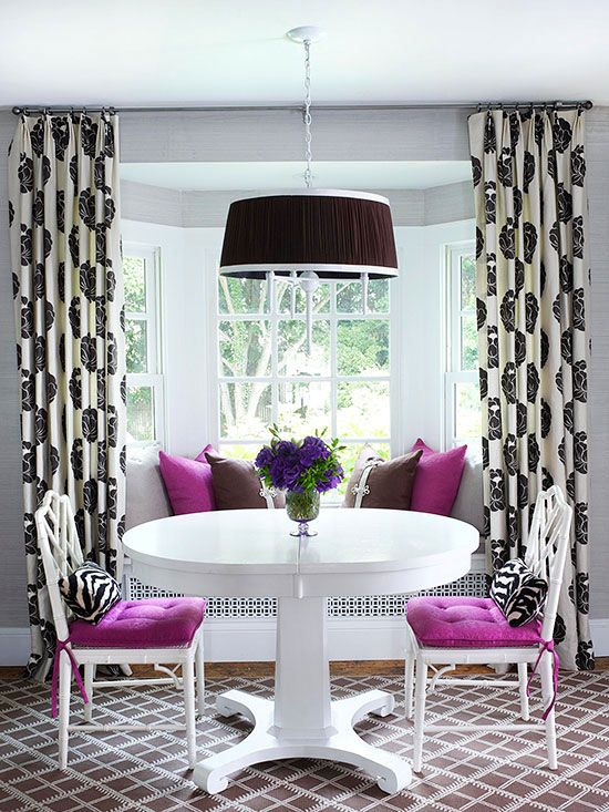 Purple Cushions Add a Pop of Color to White Chairs