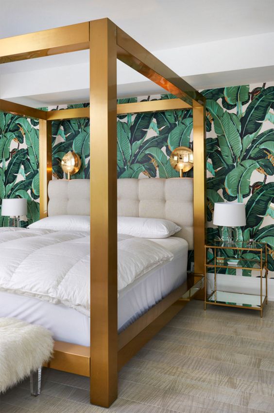 Gold Bed Frame Contrasts with Tropical Wallpaper