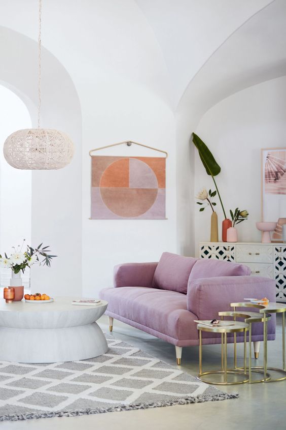 Geometric Wall Hanging Adds a Soft Focal Point Above the Sofa