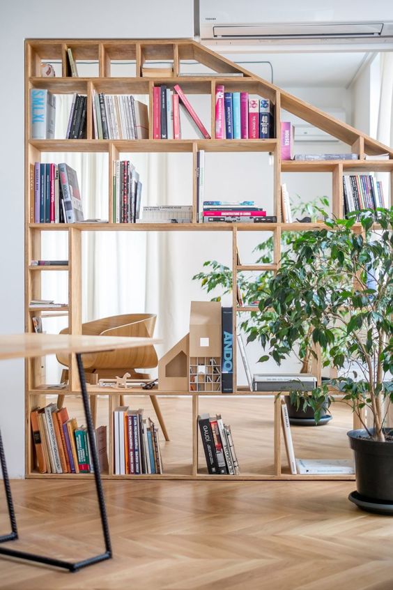 Custom Wood Shelving That Follows Staircase Angles