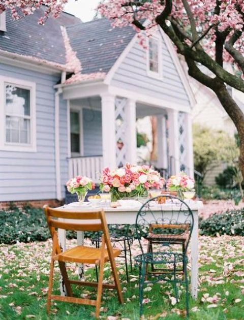 Wooden Folding Chairs Add Casual Comfort Around A White Table