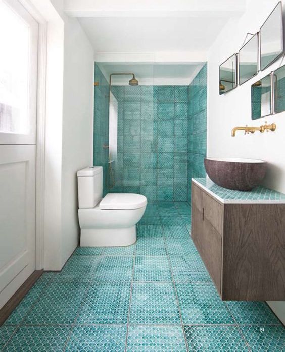 Scalloped Turquoise Floor Tiles Create a Textured Foundation